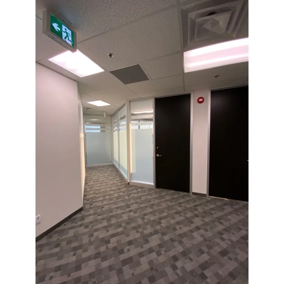 hallway with corporate-style carpets